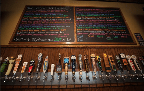 Beer taps and menu board in bar