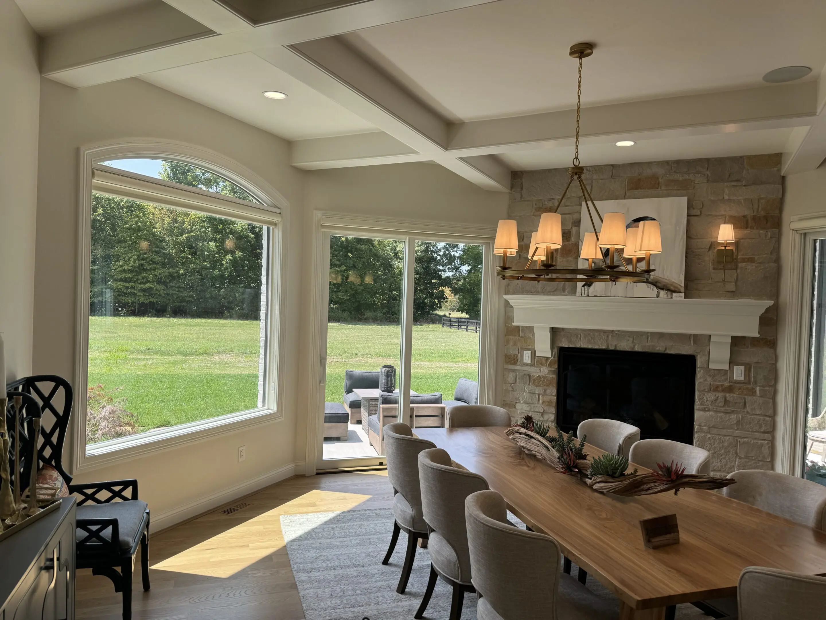 Dining room with large windows and fireplace