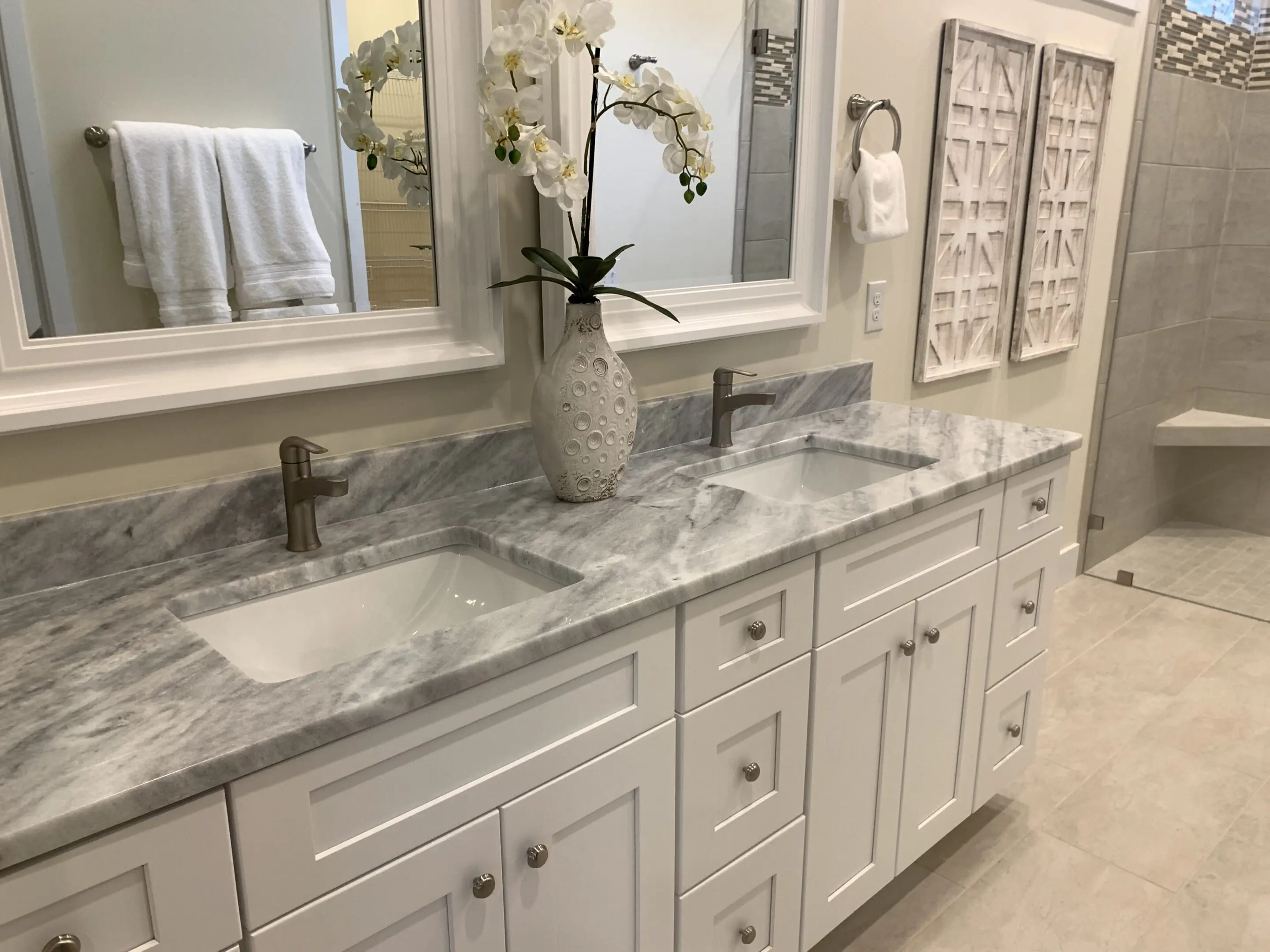 White double sink marble bathroom vanity with orchid