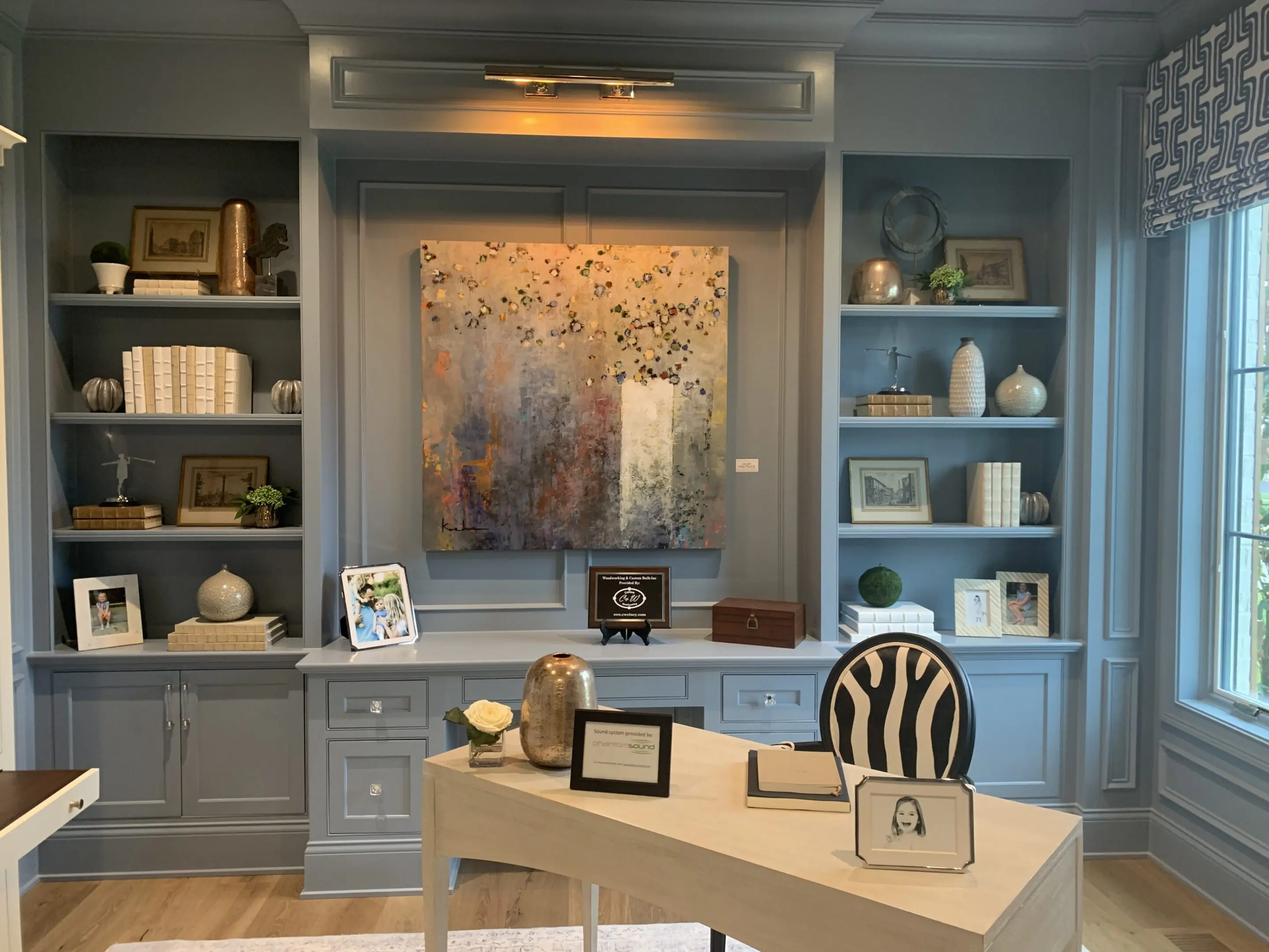 Blue built-in office with abstract painting