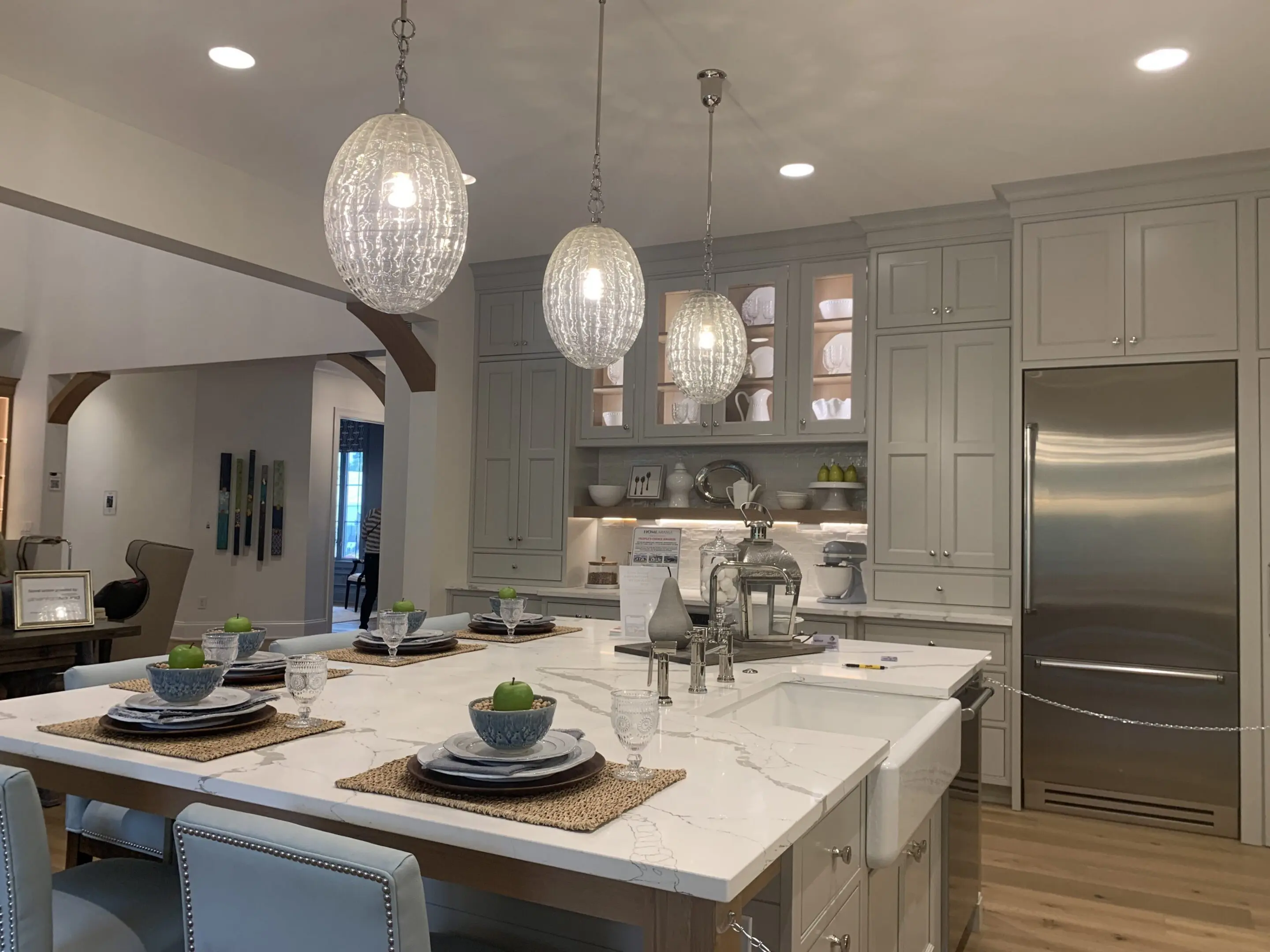 Marble kitchen island with pendant lights