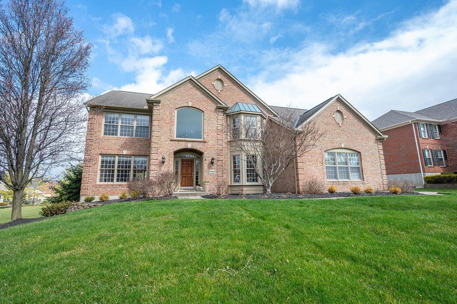 Two-story suburban home on sunny day