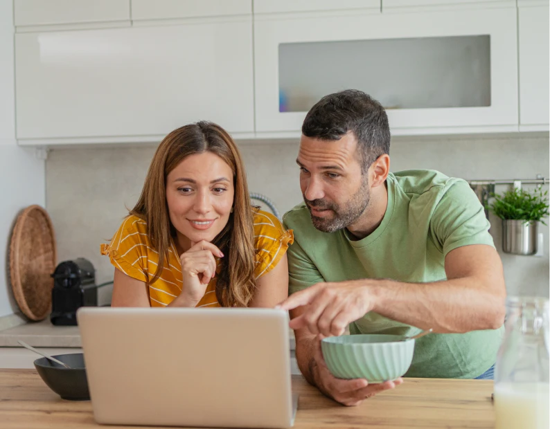 Man and woman looking at screen