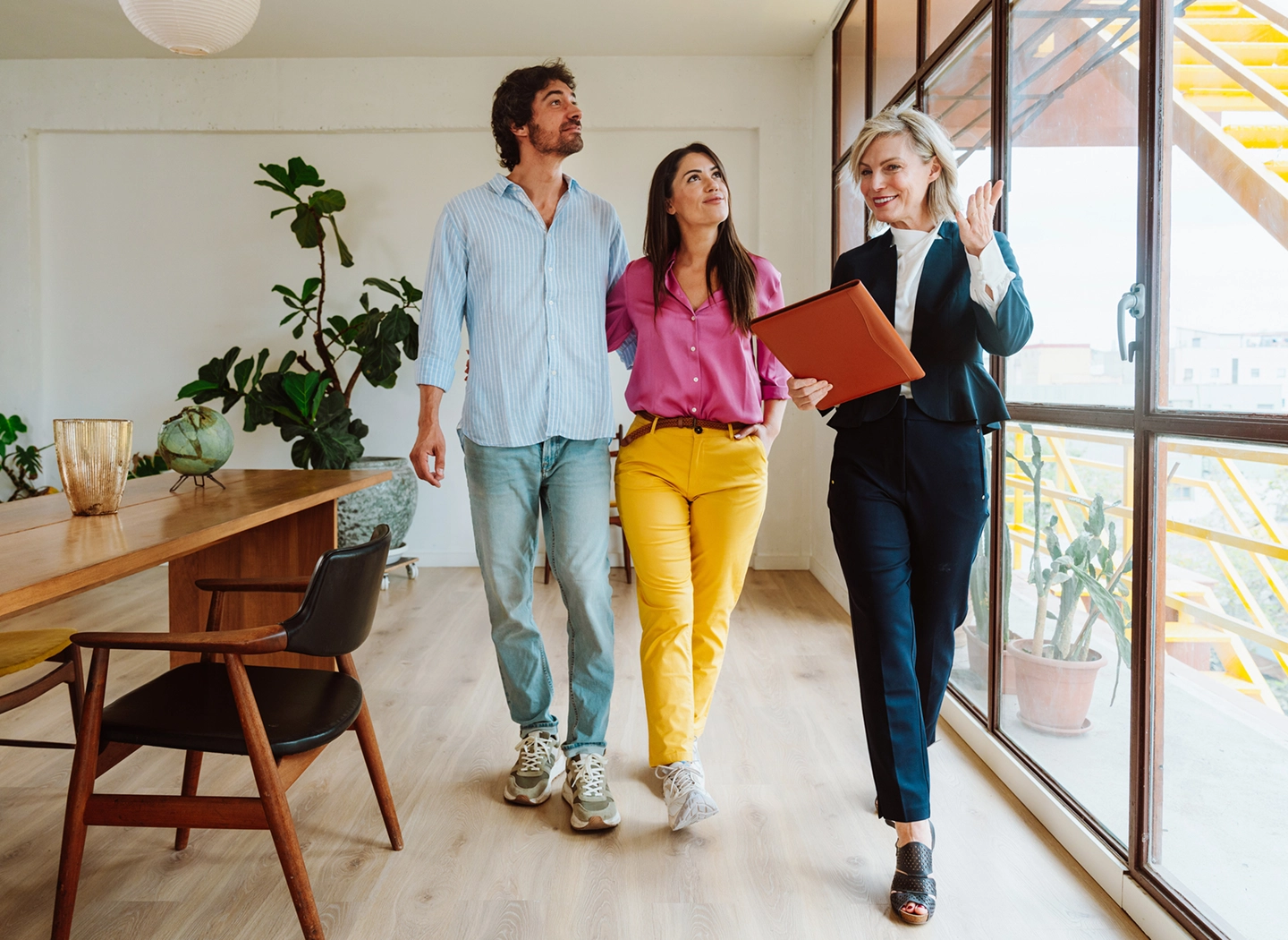 Couple touring home with real estate agent