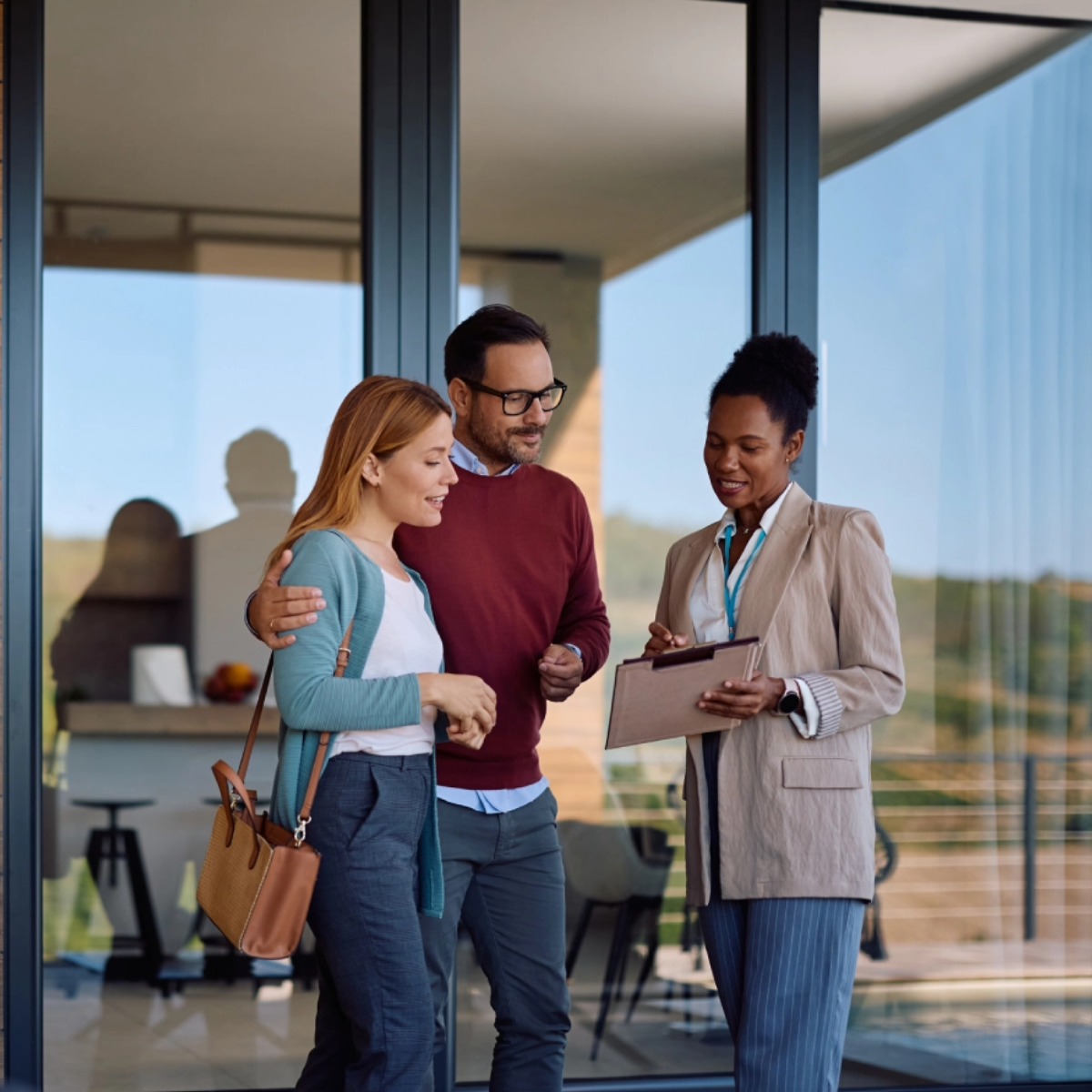 Realtor showing couple a modern home
