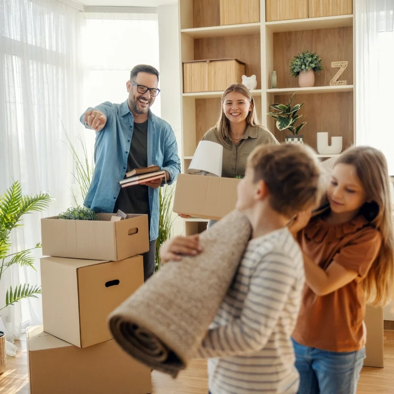 Family moving into new home with boxes